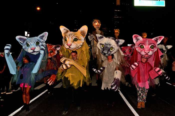 Cats march together at the 2024 Village Halloween Parade.