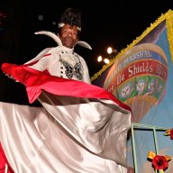 Grand marshal André De Shields shows his costume.