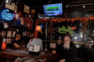 Patrons watch the results of Proposal 1 at Julius' in Manhattan on election night, Nov. 5, 2024.