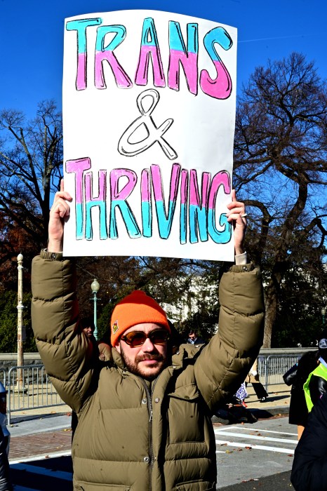 Advocates held signs defending trans rights and gender-affirming care.