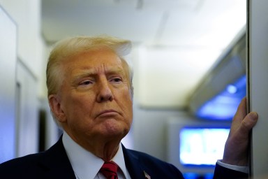 U.S. President Donald Trump speaks to reporters aboard Air Force One before arriving at Joint Base Andrews, Maryland, U.S., January 27, 2025.