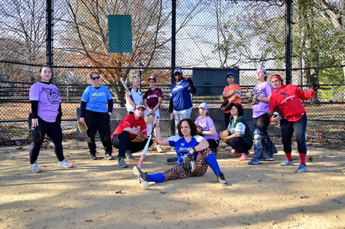 Members of The Prospect Park Women's Softball League gather on the field near home plate.