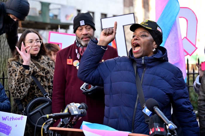 Tanya Asapansa-Johnson Walker, a military veteran, delivers remarks.