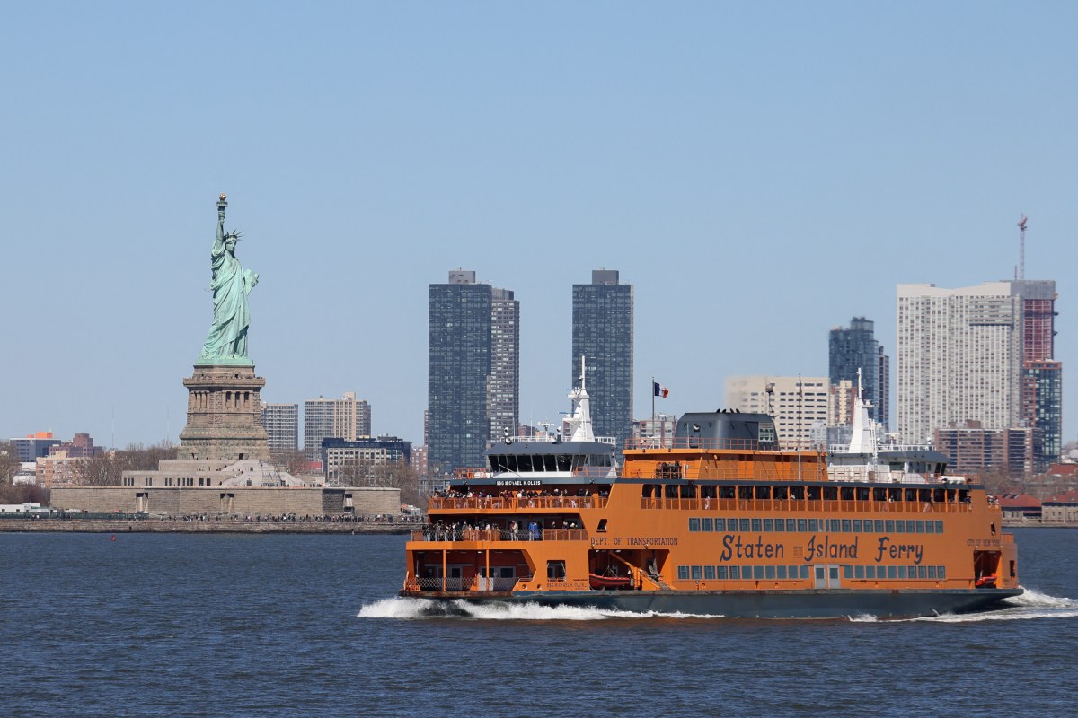 The Staten Island Ferry passes the Statue of Liberty in New York City, U.S., March 18, 2025.