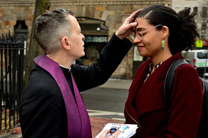 Rev. Liz Edman (left) offers glitter+ash.