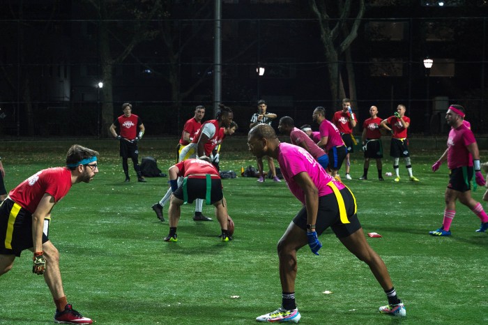 Preparing to snap the ball during a New York Gay Football League game.