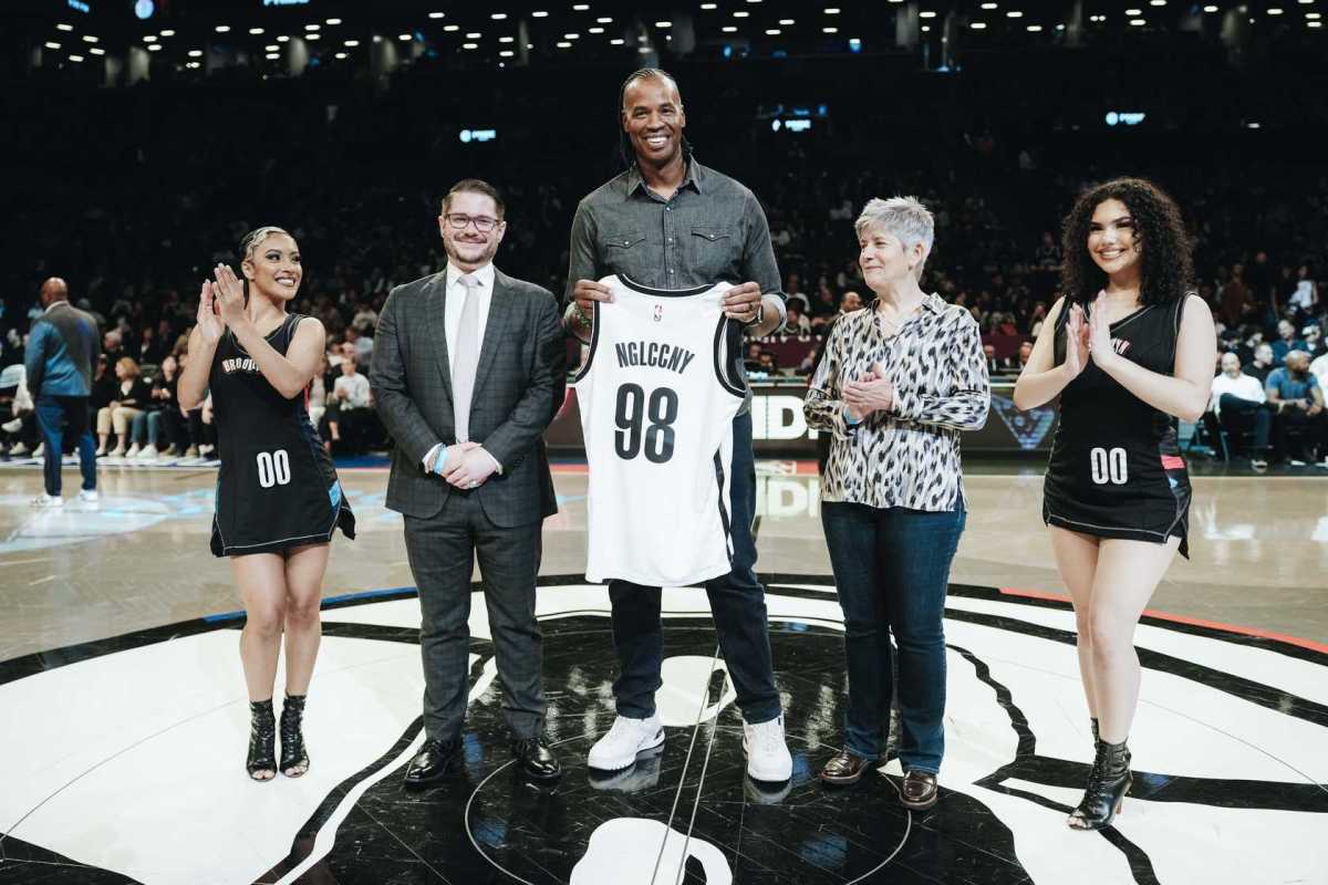 Jason Collins, center, is flanked by Barton Lee Jackson III to his left and Phyllis Mehalakes to his right.
