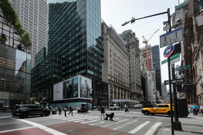 Pedestrians walk past a retail space at 715-717 Fifth Avenue in New York City, U.S., May 27, 2025.