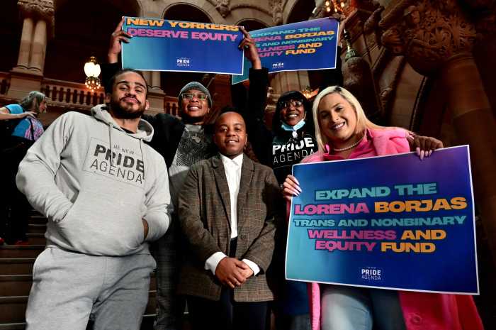 Kei Williams (center) surrounded by the New Pride Agenda team during a rally in Albany in February.