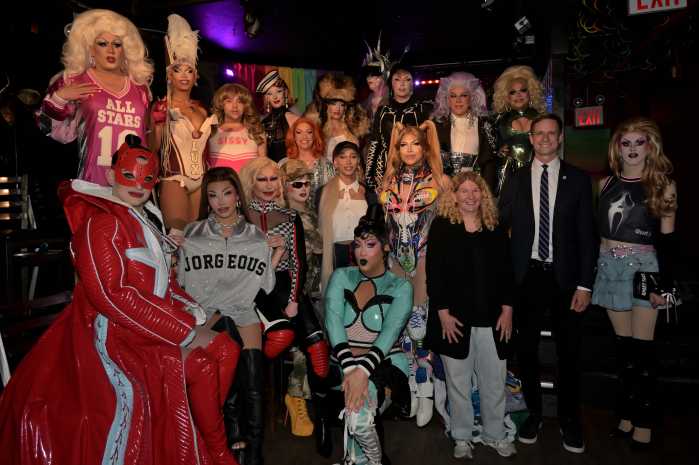 The cast of RuPaul's Drag Race All Stars Season 10 stands with Councilmember Erik Bottcher (second from right in the middle row) and Stonewall Inn co-owner Stacy Lentz (next to Bottcher)