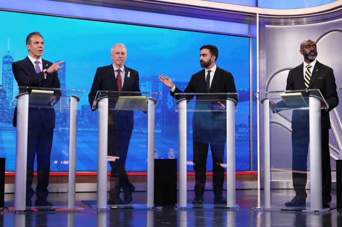 Democratic mayoral candidates Andrew Cuomo and Zohran Mamdani present arguments as Whitney Tilson and Michael Blake look on during a Democratic mayoral primary debate, Wednesday, June 4, 2025, in New York.