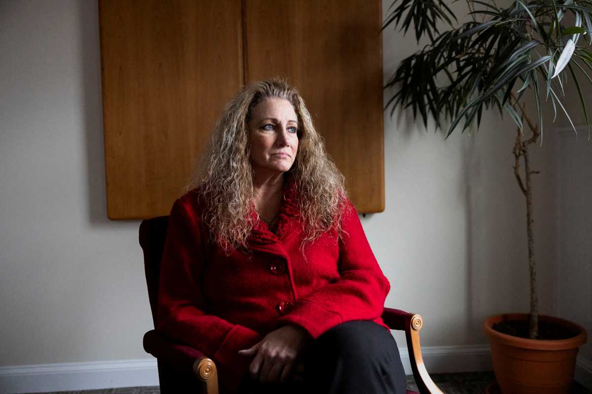 Marlean Ames sits for a portrait at the law office of Edward Gilbert, her lawyer, in Akron, Ohio, U.S., February 13, 2025.