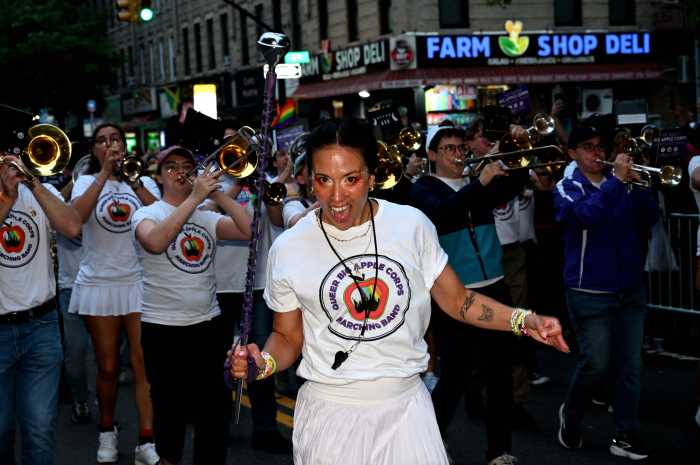Members of Queer Big Apple Corps along the parade route.