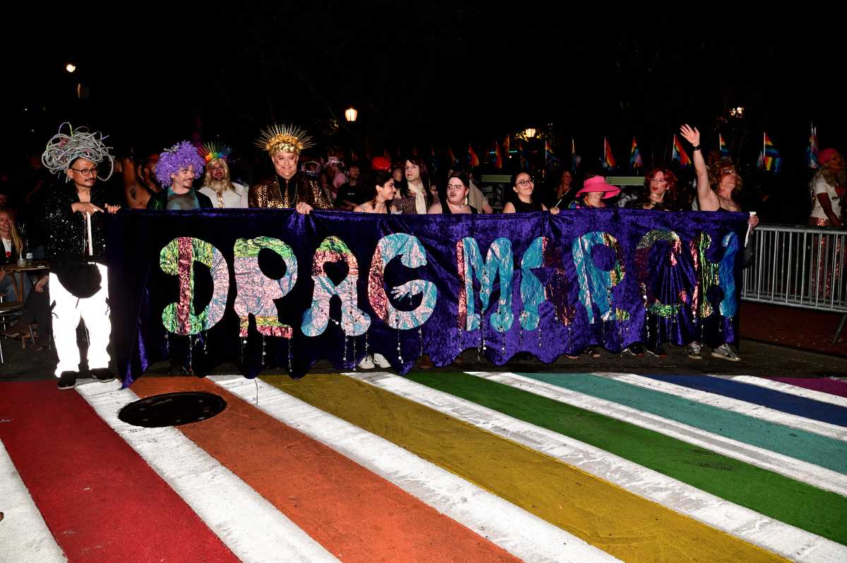 The Drag March banner leads the way.