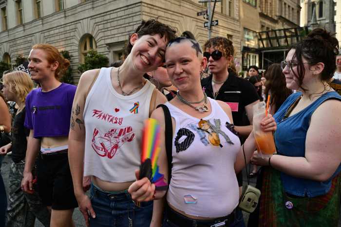 Rainbow fans help beat the heat.