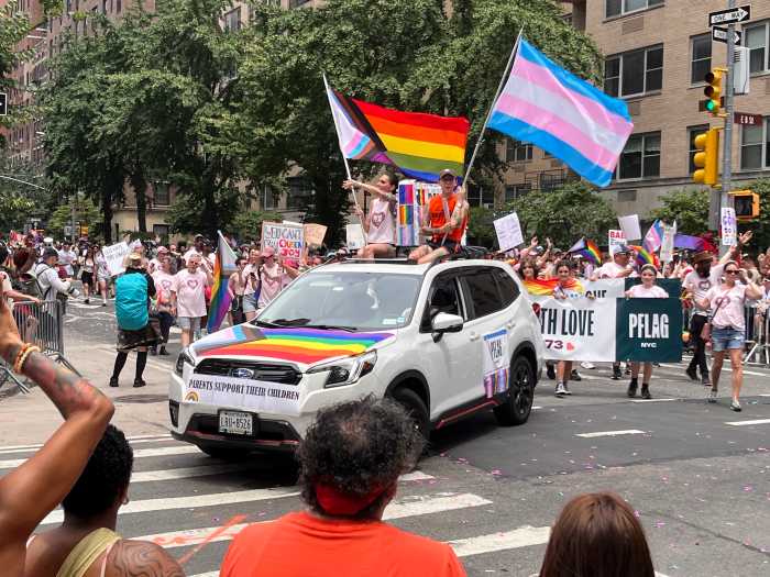 The PFLAG contigent turns a corner on the parade route.