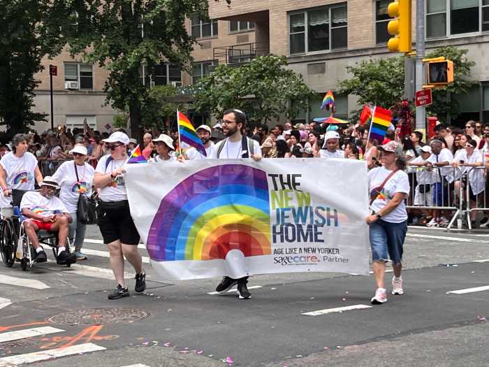The New Jewish Home's banner moves along the route.