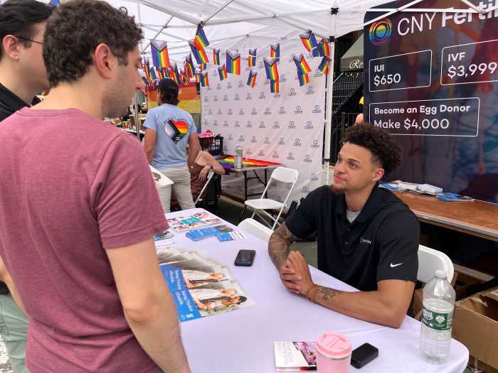 Joseph Atkins of CNY Fertility engages with visitors.