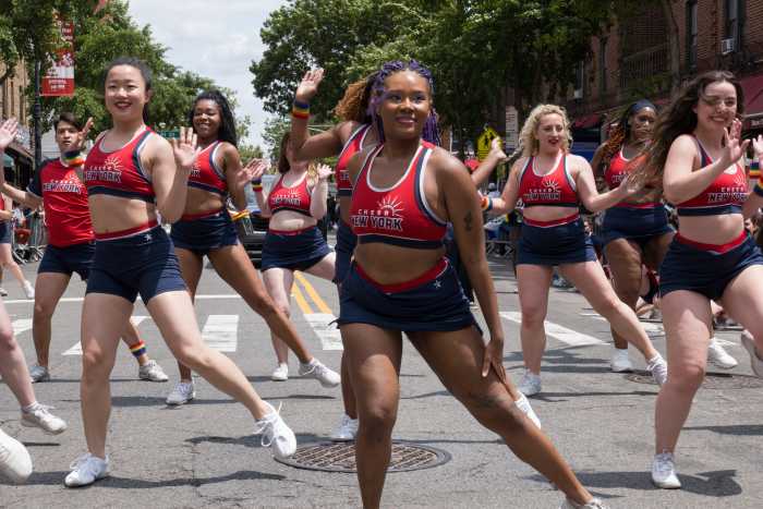 Cheer New York delivers a performance along the parade route.