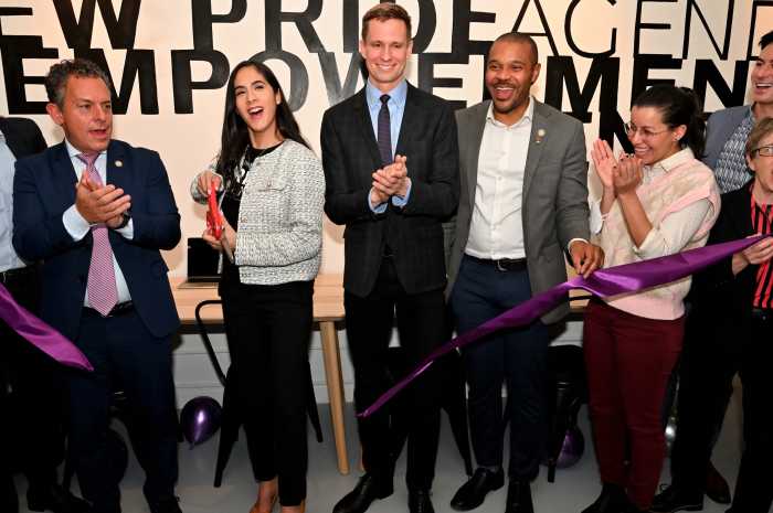 Elisa Crespo, seen here in January of 2024 during her time with New Pride Agenda, cuts the ribbon to signal the official opening of a drop-in space in Manhattan.