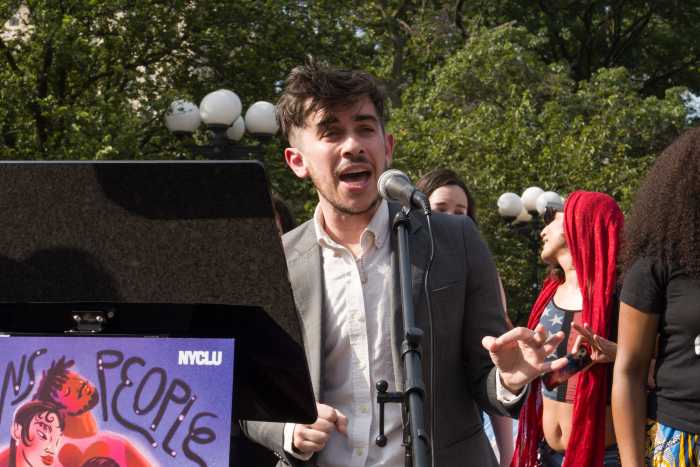 Chase Strangio of the ACLU delivers remarks to the audience.