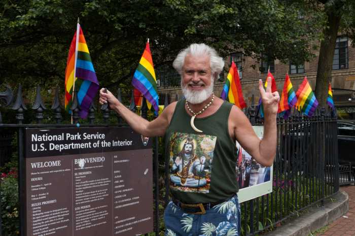 Steven Love Menendez watches over the Rainbow Flags at the park.