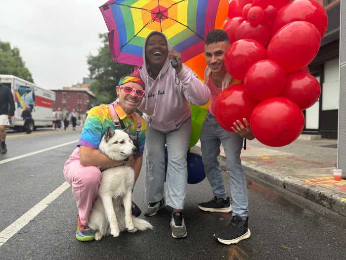 Zack Reedy, Danielle Jackson, and David Echevarria share a moment at Brooklyn Pride.
