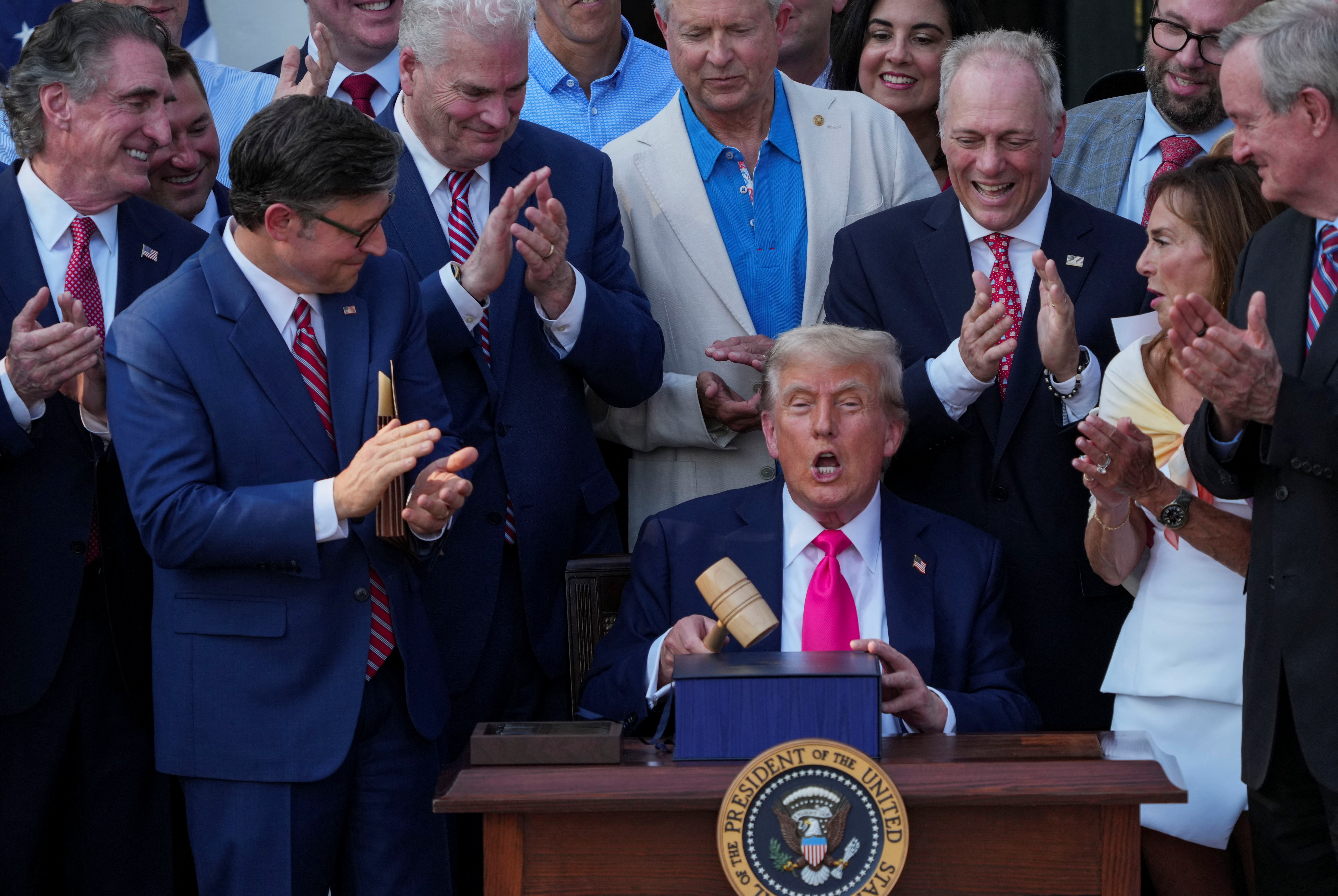US President Donald Trump uses a gavel after signing the sweeping spending and tax legislation, known as the "One Big Beautiful Bill Act," at the White House in Washington, D.C., U.S., July 4, 2025.