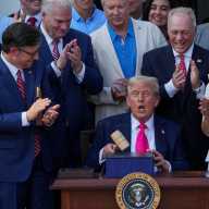 US President Donald Trump uses a gavel after signing the sweeping spending and tax legislation, known as the "One Big Beautiful Bill Act," at the White House in Washington, D.C., U.S., July 4, 2025.