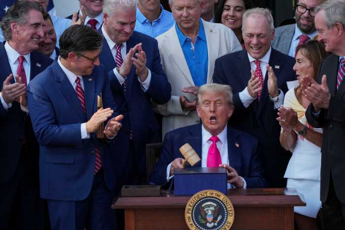 US President Donald Trump uses a gavel after signing the sweeping spending and tax legislation, known as the "One Big Beautiful Bill Act," at the White House in Washington, D.C., U.S., July 4, 2025.