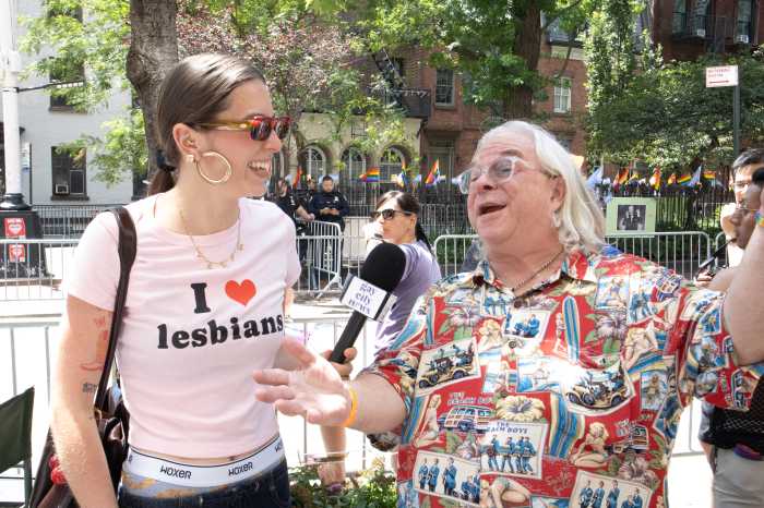 Ellie J Rudy (left) conducts interviews outside the Stonewall Inn at NYC Pride on June 29.