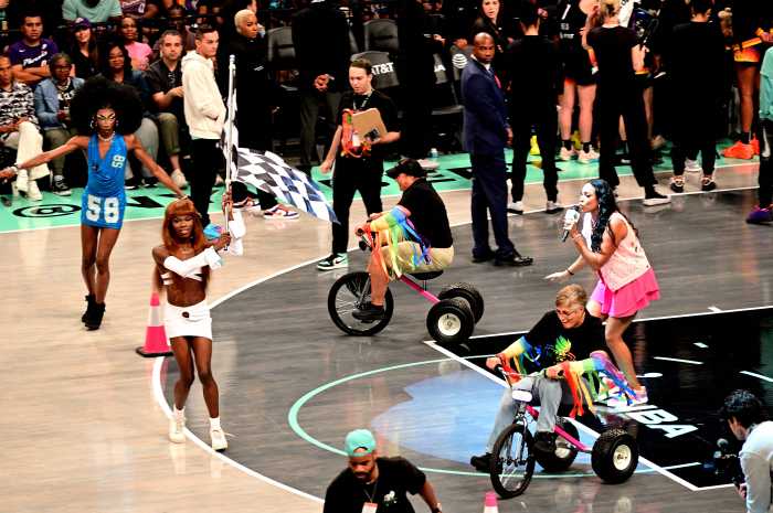 Racing tricycles on the court.