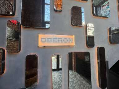 Upon entering Oberon, patrons are greeted by a collection of mirrors and a sign introducing the space.