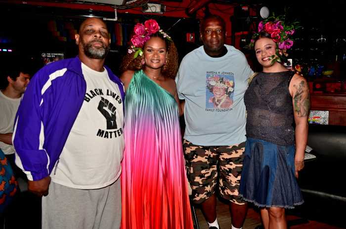Raquel Willis (center) with Marsha P. Johnson's cousins.