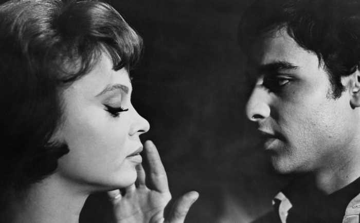 A man and a woman's faces are close together in a black and white scene in “Who Killed Teddy Bear," directed by Joseph Cates, opens Aug. 8 at the Film Forum.