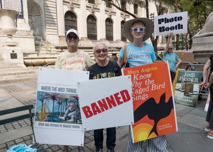 Ann Holder, Roberta Degnore, and Anne Maguire stand together against book bans.