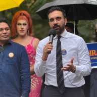 Zohran Mamdani, wearing a "Gays for Zohran" pin, delivers remarks to the crowd at a National Coming Out Day rally on Oct. 11.