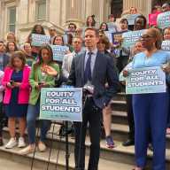 Councilmember Erik Bottcher speaks at a Sept. 30 rally against the Trump administration's anti-trans funding cuts.