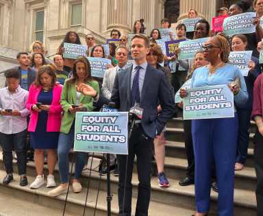 Councilmember Erik Bottcher speaks at a Sept. 30 rally against the Trump administration's anti-trans funding cuts.