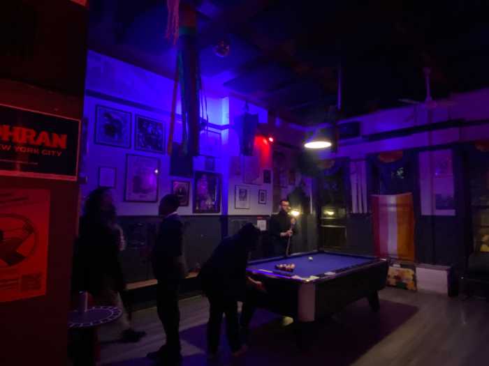 Mixer Attendees Playing Pool and Chatting