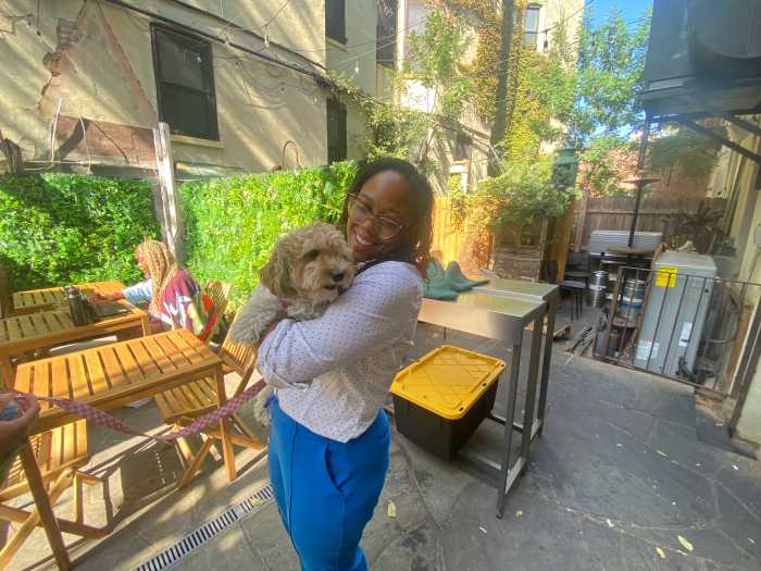 Tiffany Dockery holding a customers dog