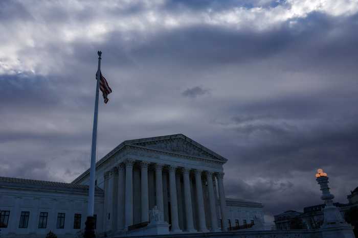 A US Flag flutters outside of the United States Supreme Court Building in Washington on Dec. 5, 2024.