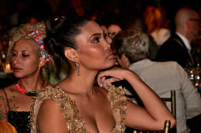 Leyna Bloom looks on.