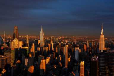The Empire State Building and Midtown Manhattan are bathed in the light of the setting sun, as viewed from the Edge NYC, in New York City, U.S., December 29, 2025.