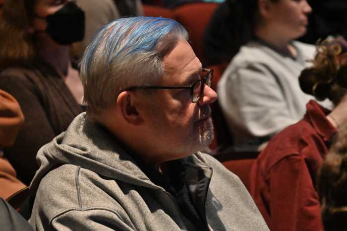 Thomas Duane, an out gay former elected official who served in the City Council and State Senate, looks on.