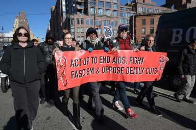 An afternoon march on World AIDS Day featured a die-in in front of the Stonewall Inn.