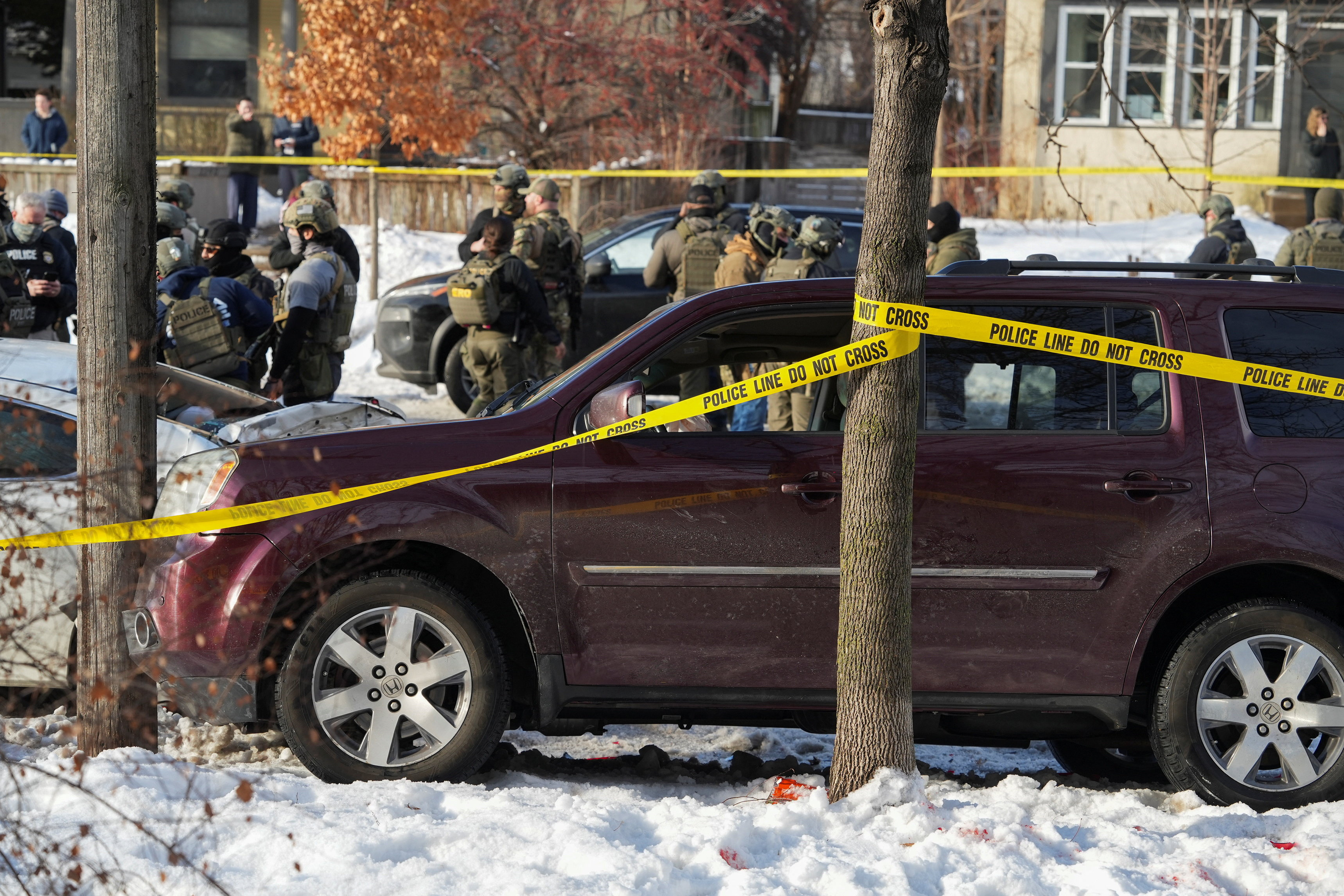 Police tape surrounds a vehicle after its driver was shot by a U.S. immigration agent, according to local and federal officials, in Minneapolis, Minnesota, U.S., January 7, 2026.