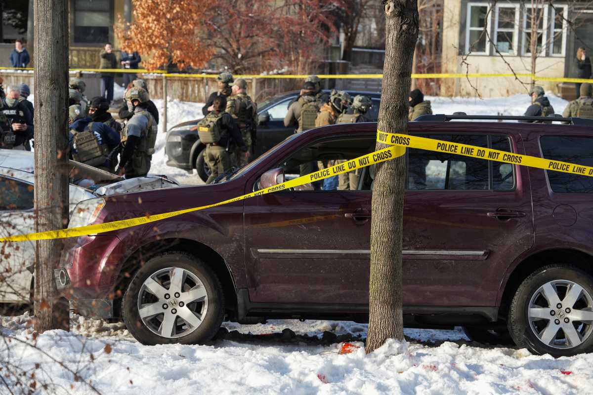 Police tape surrounds a vehicle after its driver was shot by a U.S. immigration agent, according to local and federal officials, in Minneapolis, Minnesota, U.S., January 7, 2026.