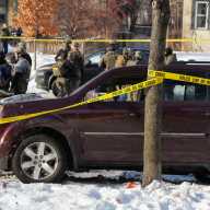 Police tape surrounds a vehicle after its driver was shot by a U.S. immigration agent, according to local and federal officials, in Minneapolis, Minnesota, U.S., January 7, 2026.