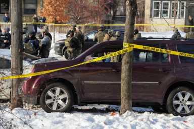 Police tape surrounds a vehicle after its driver was shot by a U.S. immigration agent, according to local and federal officials, in Minneapolis, Minnesota, U.S., January 7, 2026.